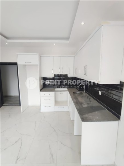 Inexpensive apartment with fine finishing 1200 meters from the sea, in the promising resort area of Alanya - Avsallar-id-7904-photo-3