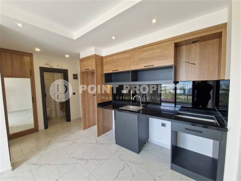 New 1+1 apartment with high-quality finishing in a modern area of Alanya - Mahmutlar-id-7932-photo-3