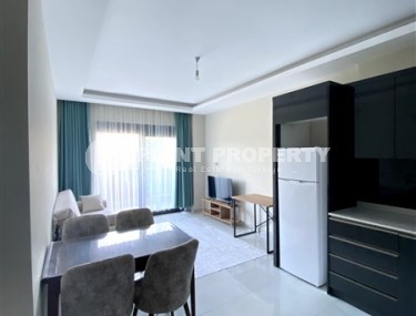 Ready-to-move-in apartment 1+1, with a total area of 45 m2, on the 1st floor in a new residential complex with hotel infrastructure-id-7933-photo-2