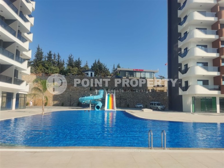 Ready-to-move-in apartment 1+1, with a total area of 45 m2, on the 1st floor in a new residential complex with hotel infrastructure-id-7933-photo-9