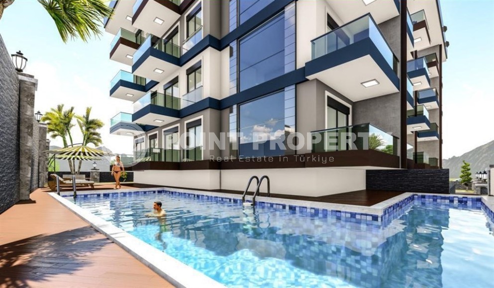 Квартира 1+1 в жилом комплексе на завершающем этапе строительства, в нескольких минутах ходьбы от центра района Махмутлар-id-7935-фото-6