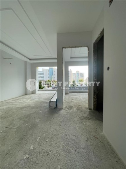 Квартира 1+1 в жилом комплексе на завершающем этапе строительства, в нескольких минутах ходьбы от центра района Махмутлар-id-7935-фото-9