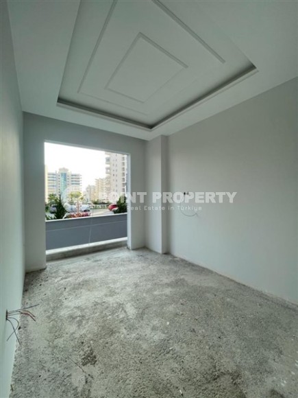 Квартира 1+1 в жилом комплексе на завершающем этапе строительства, в нескольких минутах ходьбы от центра района Махмутлар-id-7935-фото-12