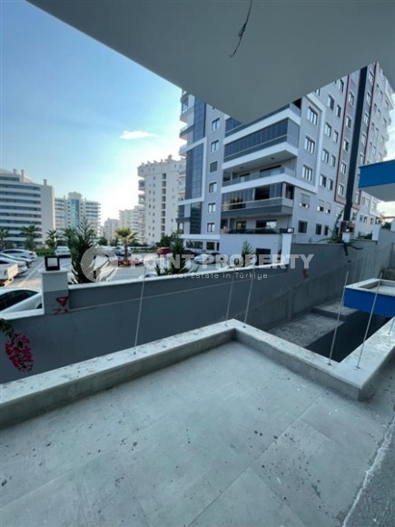 Квартира 1+1 в жилом комплексе на завершающем этапе строительства, в нескольких минутах ходьбы от центра района Махмутлар-id-7935-фото-13