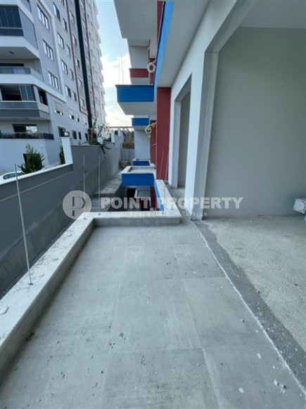 Квартира 1+1 в жилом комплексе на завершающем этапе строительства, в нескольких минутах ходьбы от центра района Махмутлар-id-7935-фото-14