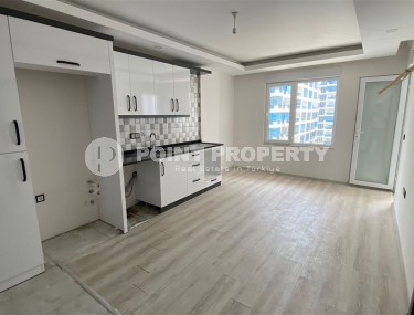 Доступная по цене квартира 1+1, общей площадью 55 м2, в центре популярного района Аланьи - Махмутлар-id-7941-фото-2