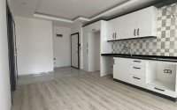 Доступная по цене квартира 1+1, общей площадью 55 м2, в центре популярного района Аланьи - Махмутлар-id-7941-фото-3