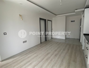 Доступная по цене квартира 1+1, общей площадью 55 м2, в центре популярного района Аланьи - Махмутлар-id-7941-фото-4