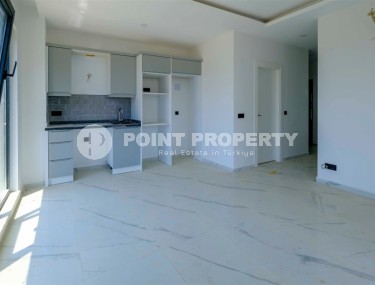 Compact new apartment with fine finishing 750 meters from the sea, in the center of Mahmutlar-id-7943-photo-3