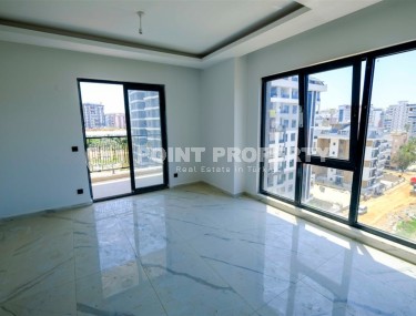 Compact new apartment with fine finishing 750 meters from the sea, in the center of Mahmutlar-id-7943-photo-4