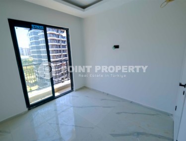 Compact new apartment with fine finishing 750 meters from the sea, in the center of Mahmutlar-id-7943-photo-5
