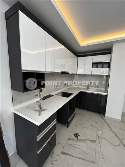 Новая квартира в центре района Махмутлар, на 1-м этаже в жилом комплексе, введенном в эксплуатацию в 2023 году-id-7946-фото-3