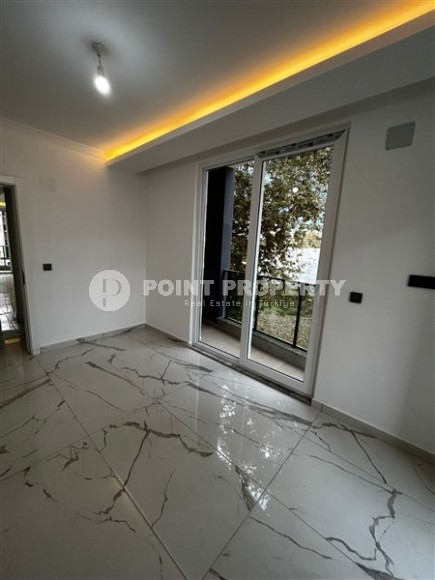 Новая квартира в центре района Махмутлар, на 1-м этаже в жилом комплексе, введенном в эксплуатацию в 2023 году-id-7946-фото-5