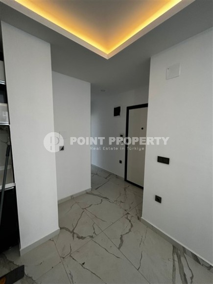 Новая квартира в центре района Махмутлар, на 1-м этаже в жилом комплексе, введенном в эксплуатацию в 2023 году-id-7946-фото-6