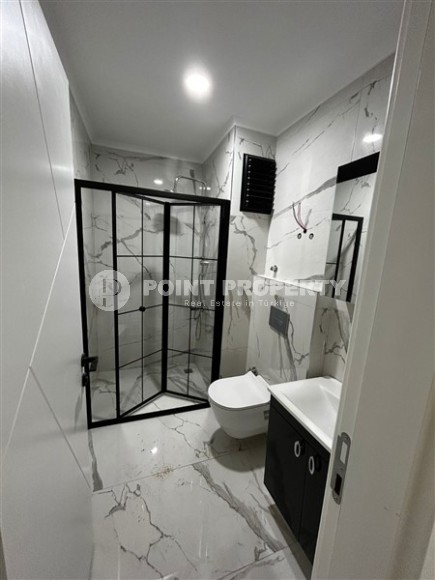 Новая квартира в центре района Махмутлар, на 1-м этаже в жилом комплексе, введенном в эксплуатацию в 2023 году-id-7946-фото-7