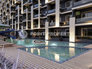 Недорогие квартиры 1+1 и студии в 300 метрах от моря, в центре курортного района Мерсина - Эрдемли-id-7950-фото-2