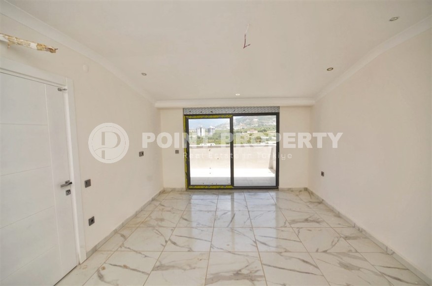 Новая двухуровневая квартира с чистовой отделкой в 900 метрах от моря, в современном районе Аланьи - Махмутлар-id-7980-фото-7