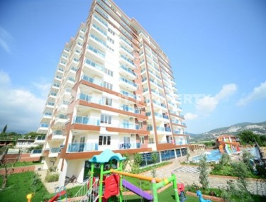 Spacious 1+1 apartment, with a total area of 70 m2, on the 3rd floor in a residential complex with hotel infrastructure in the center of Mahmutlar district-id-8002-photo-1