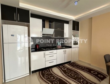 Spacious 1+1 apartment, with a total area of 70 m2, on the 3rd floor in a residential complex with hotel infrastructure in the center of Mahmutlar district-id-8002-photo-5