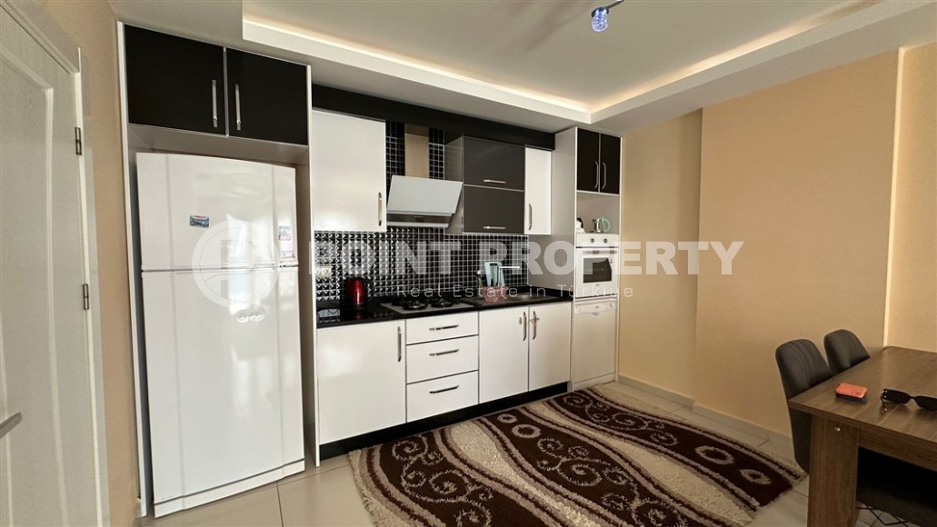 Spacious 1+1 apartment, with a total area of 70 m2, on the 3rd floor in a residential complex with hotel infrastructure in the center of Mahmutlar district-id-8002-photo-5