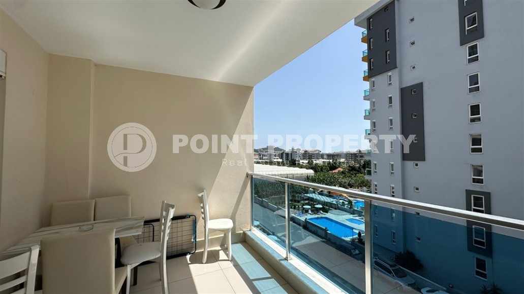 Spacious 1+1 apartment, with a total area of 70 m2, on the 3rd floor in a residential complex with hotel infrastructure in the center of Mahmutlar district-id-8002-photo-10