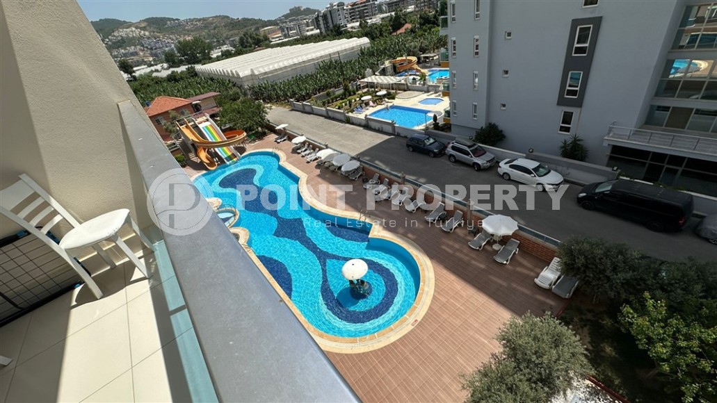 Spacious 1+1 apartment, with a total area of 70 m2, on the 3rd floor in a residential complex with hotel infrastructure in the center of Mahmutlar district-id-8002-photo-12