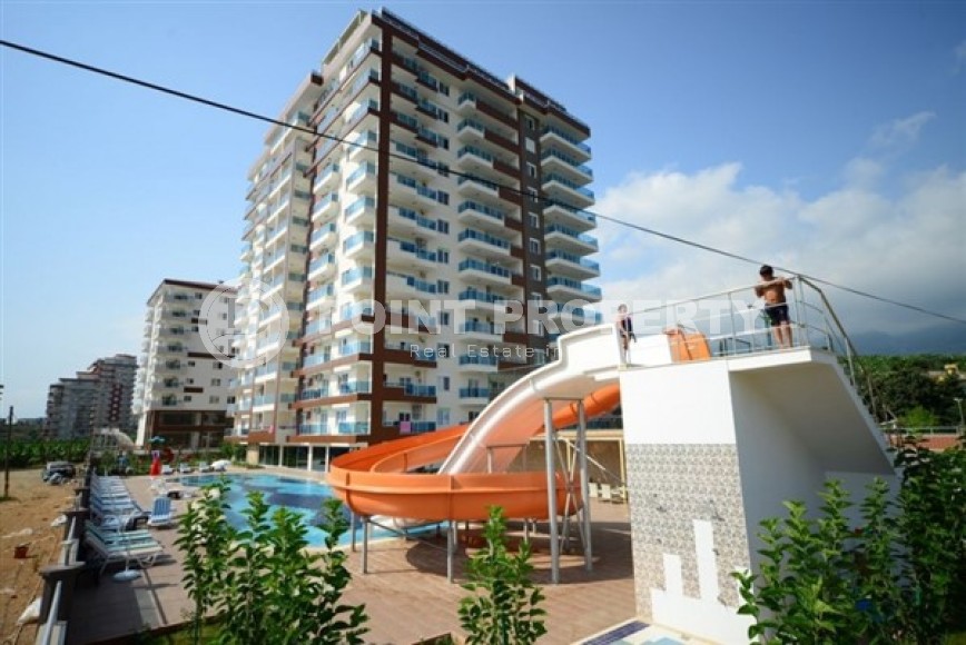 Spacious 1+1 apartment, with a total area of 70 m2, on the 3rd floor in a residential complex with hotel infrastructure in the center of Mahmutlar district-id-8002-photo-18