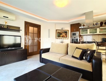 Ready-to-move-in apartment with furniture and household appliances 50 meters from the sea, in the center of the prestigious area of Alanya - Kestel-id-8043-photo-3