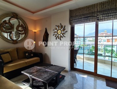 Ready-to-move-in apartment with furniture and household appliances 50 meters from the sea, in the center of the prestigious area of Alanya - Kestel-id-8043-photo-4