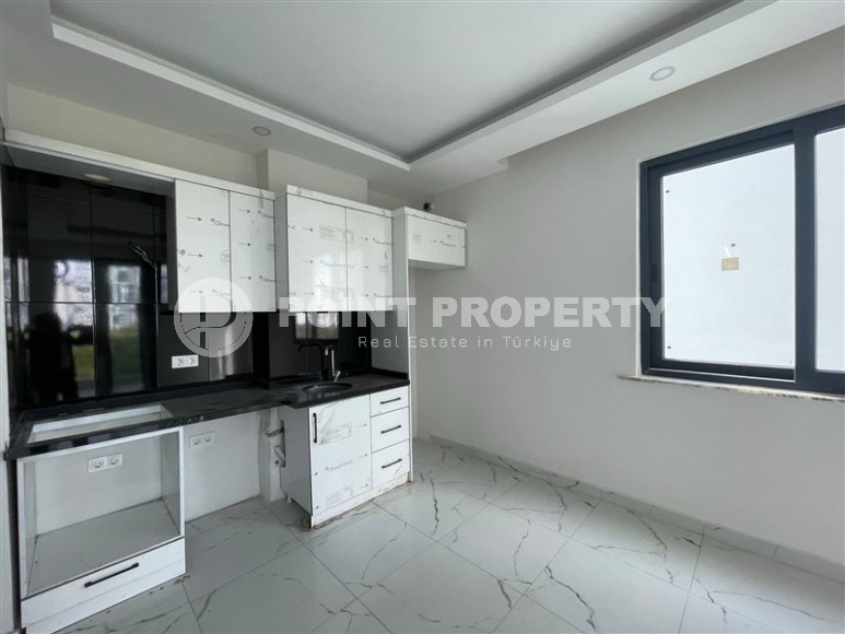 Апартаменты и дуплексы с площадью  45 - 120 м2 в резиденции на этапе строительства, район Махмутлар-id-3711-фото-3