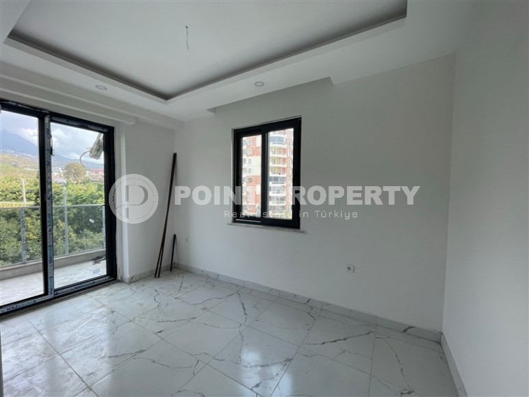 Апартаменты и дуплексы с площадью  45 - 120 м2 в резиденции на этапе строительства, район Махмутлар-id-3711-фото-5