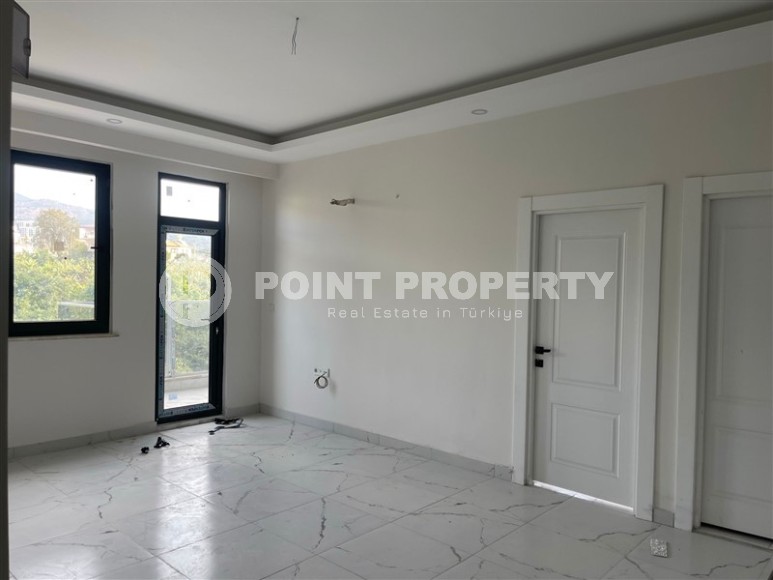 Апартаменты и дуплексы с площадью  45 - 120 м2 в резиденции на этапе строительства, район Махмутлар-id-3711-фото-6