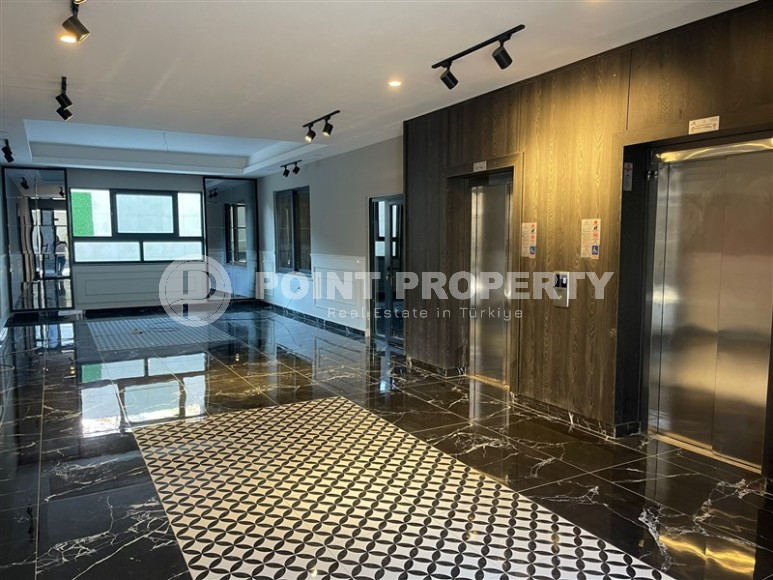 Апартаменты и дуплексы с площадью  45 - 120 м2 в резиденции на этапе строительства, район Махмутлар-id-3711-фото-8