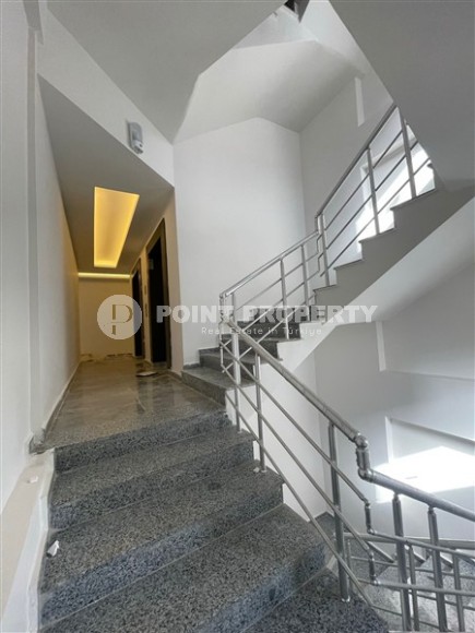 Апартаменты и дуплексы с площадью  45 - 120 м2 в резиденции на этапе строительства, район Махмутлар-id-3711-фото-9