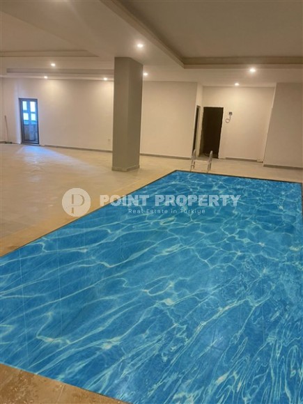 Апартаменты и дуплексы с площадью  45 - 120 м2 в резиденции на этапе строительства, район Махмутлар-id-3711-фото-11