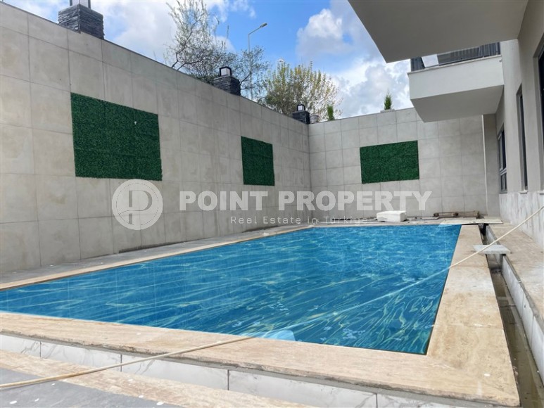 Апартаменты и дуплексы с площадью  45 - 120 м2 в резиденции на этапе строительства, район Махмутлар-id-3711-фото-16