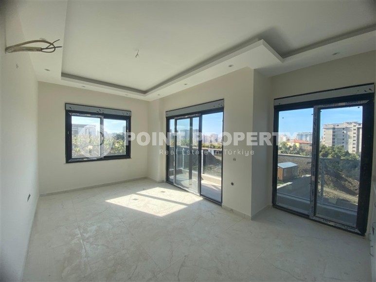 Квартиры 1+1 в жилом комплексе на завершающем этапе строительства, в популярном районе Аланьи - Махмутлар-id-8064-фото-4