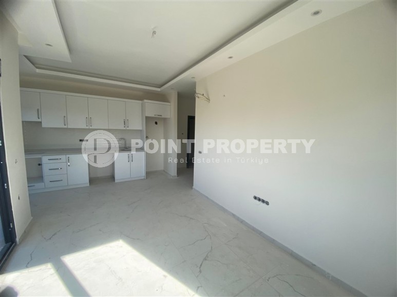 Квартиры 1+1 в жилом комплексе на завершающем этапе строительства, в популярном районе Аланьи - Махмутлар-id-8064-фото-5