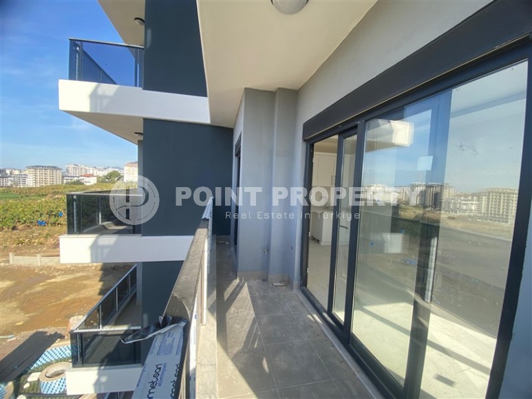 Квартиры 1+1 в жилом комплексе на завершающем этапе строительства, в популярном районе Аланьи - Махмутлар-id-8064-фото-11