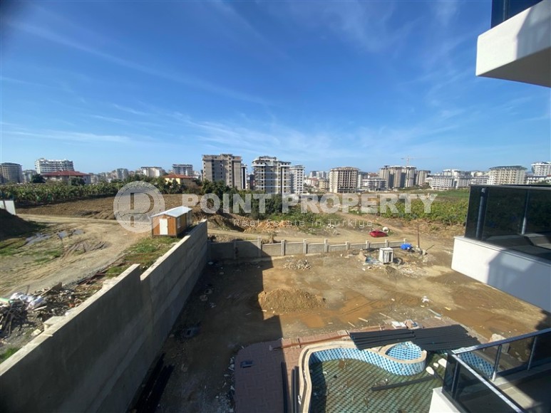 Квартиры 1+1 в жилом комплексе на завершающем этапе строительства, в популярном районе Аланьи - Махмутлар-id-8064-фото-14