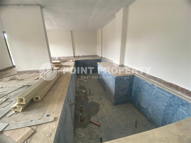 Квартиры 1+1 в жилом комплексе на завершающем этапе строительства, в популярном районе Аланьи - Махмутлар-id-8064-фото-15