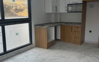 Inexpensive 1+1 apartment on the 1st floor in a residential complex at the final stage of construction-id-8065-photo-2