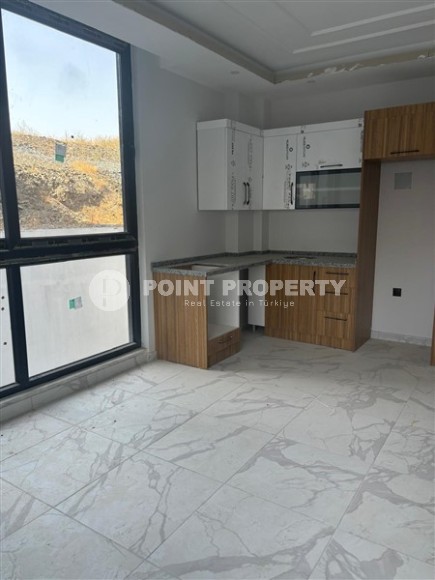 Inexpensive 1+1 apartment on the 1st floor in a residential complex at the final stage of construction-id-8065-photo-2