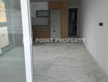 Inexpensive 1+1 apartment on the 1st floor in a residential complex at the final stage of construction-id-8065-photo-3