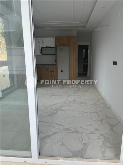 Inexpensive 1+1 apartment on the 1st floor in a residential complex at the final stage of construction-id-8065-photo-3