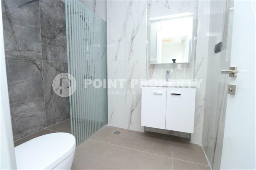 Spacious 3+1 apartment on the 5th floor in a residence at the final stage of construction in the center of Alanya-id-8080-photo-15