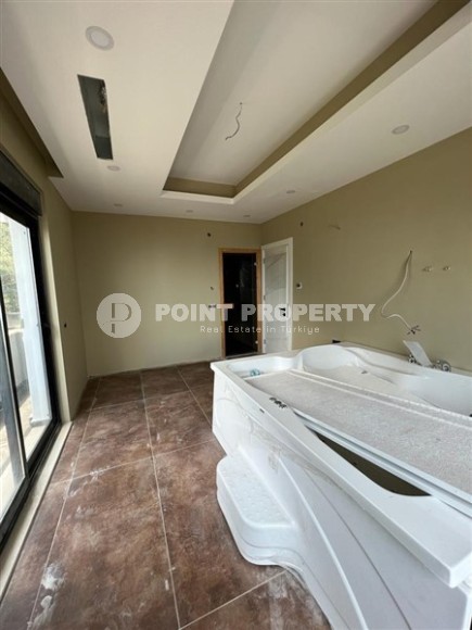 Продается отдельно стоящая вилла с лифтом и бассейном в престижном районе Бекташ, Алания.-id-8126-фото-11