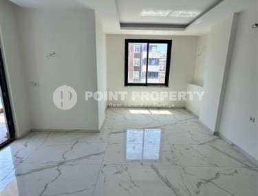 Spacious 1+1 apartment on the 3rd floor of a new modern complex in the center of Mahmutlar-id-8157-photo-3
