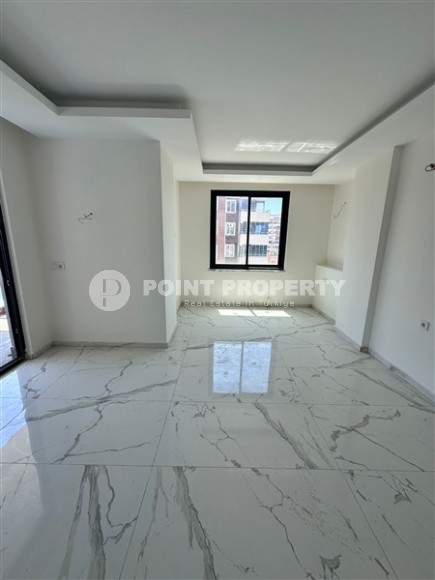 Spacious 1+1 apartment on the 3rd floor of a new modern complex in the center of Mahmutlar-id-8157-photo-3