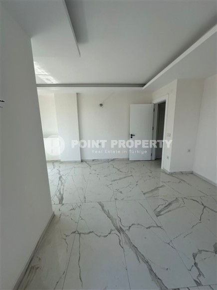 Spacious 1+1 apartment on the 3rd floor of a new modern complex in the center of Mahmutlar-id-8157-photo-4